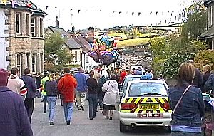 Crowd walking down hill